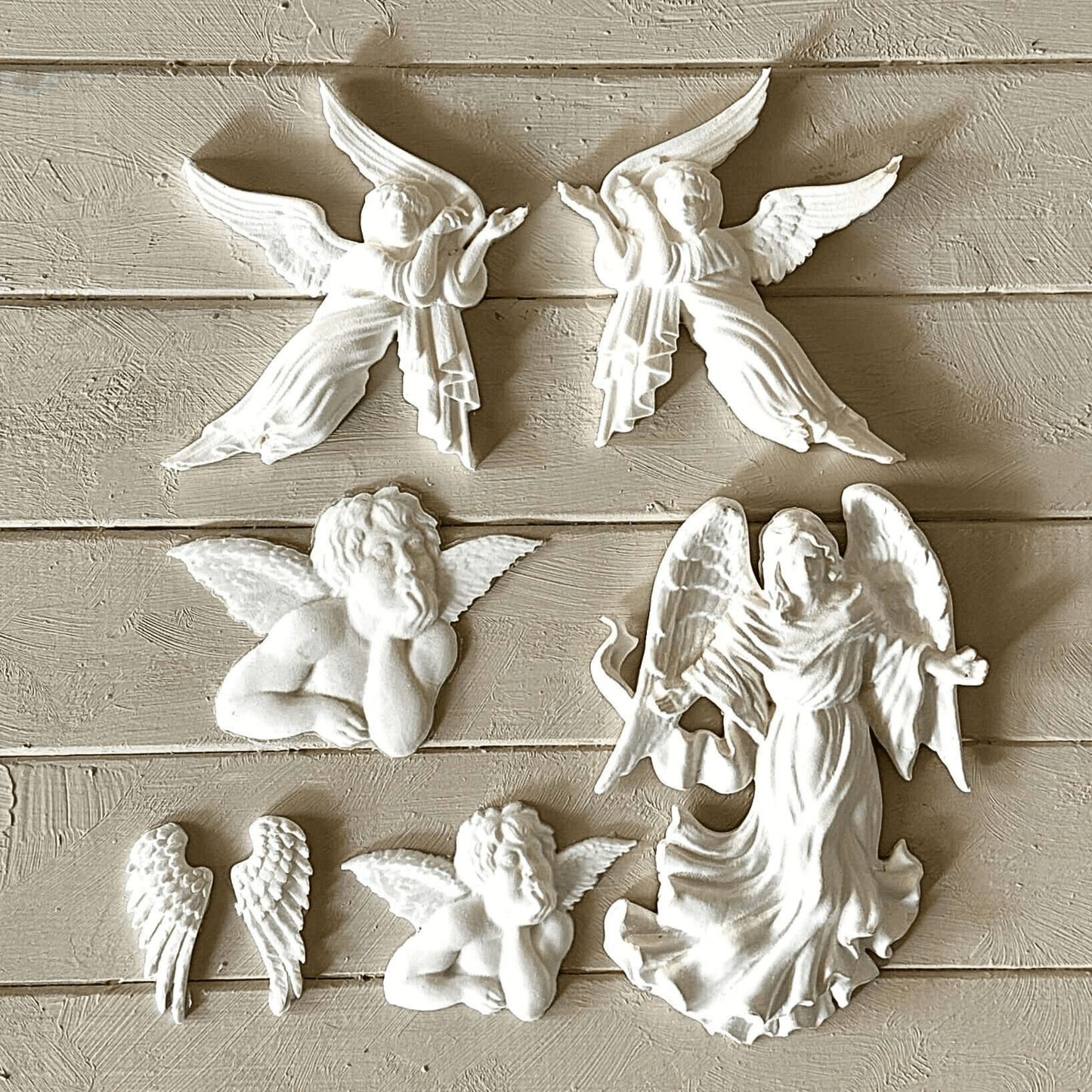 Angel 001 - Cherub Applique for Furniture & Craft Projects, featuring detailed cherub and angel designs in white resin.