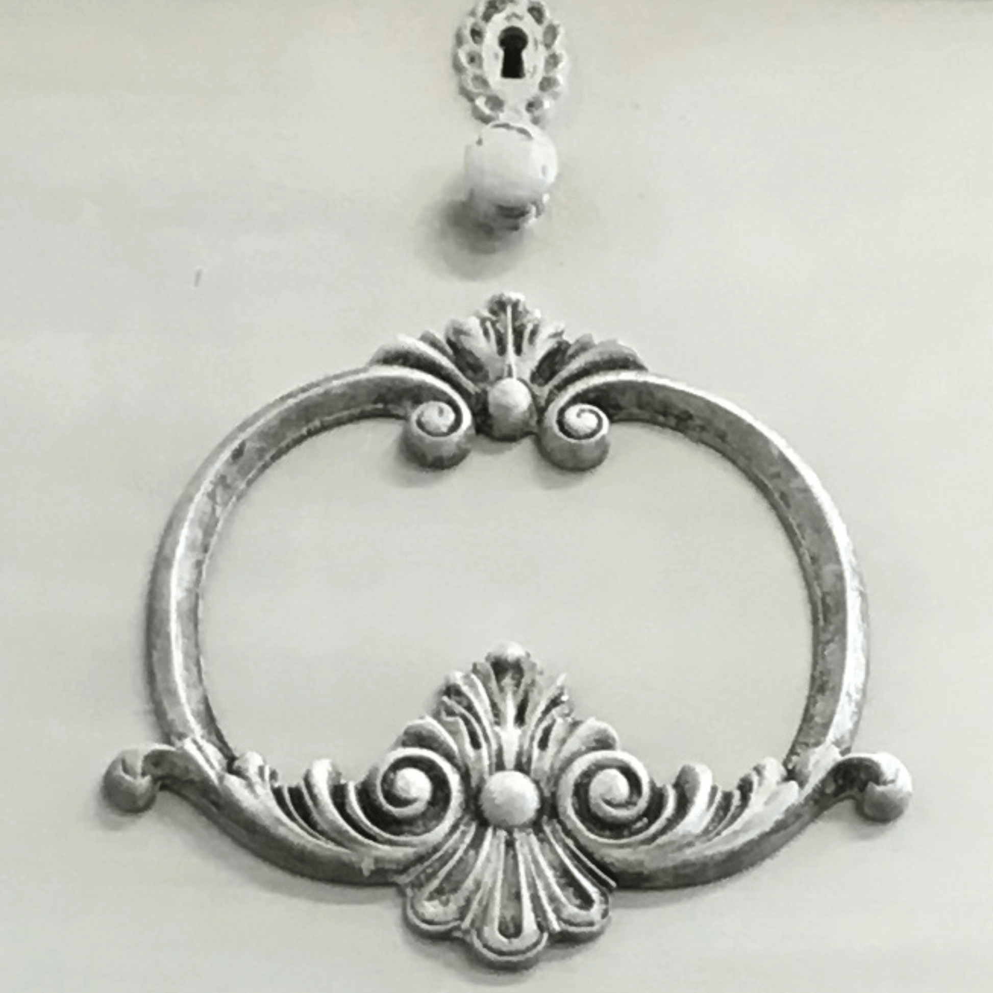 Ornate scrollwork applique painted and waxed on dresser front