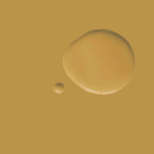 Carnaby Yellow - Annie Sloan Satin Paint showcasing rich mustard yellow paint droplets on a textured backdrop.