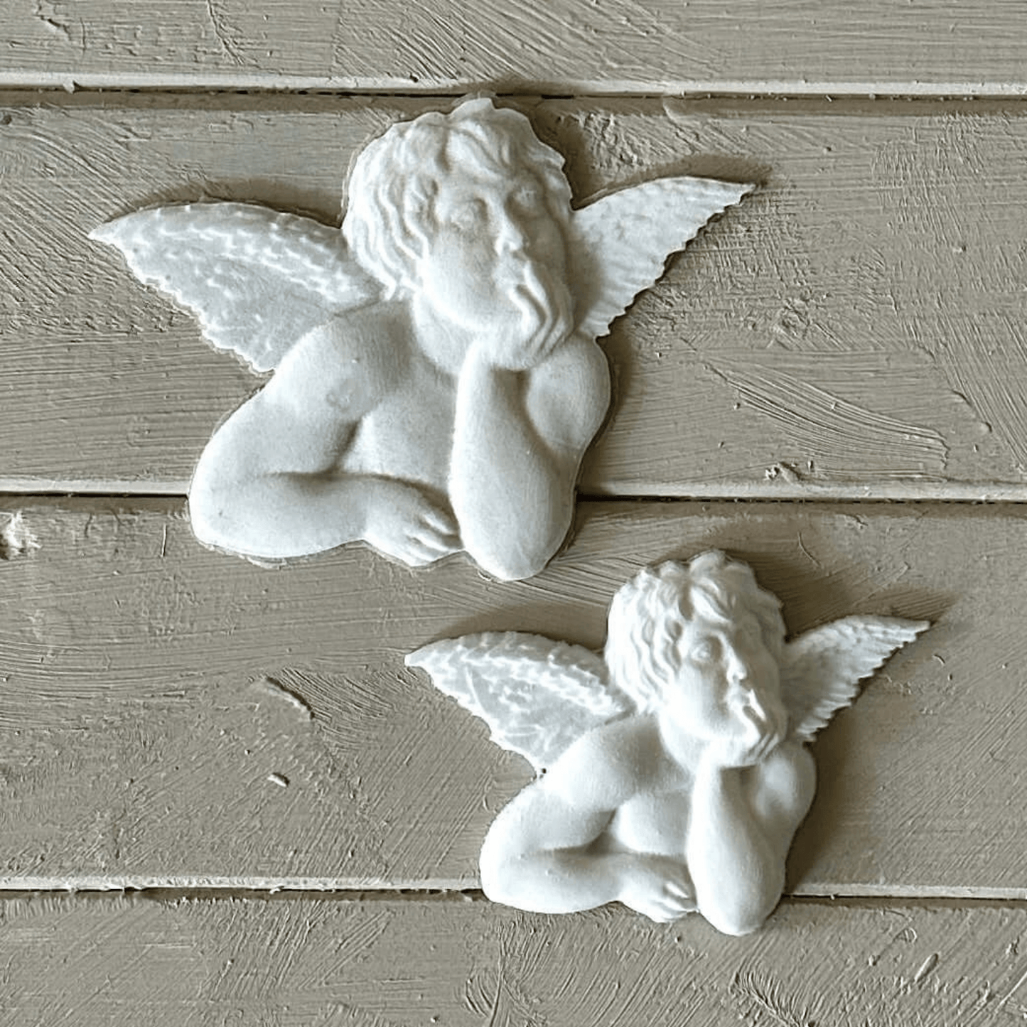 Angel 001 - Cherub Applique for Furniture & Craft Projects featuring two cherub designs in white resin.