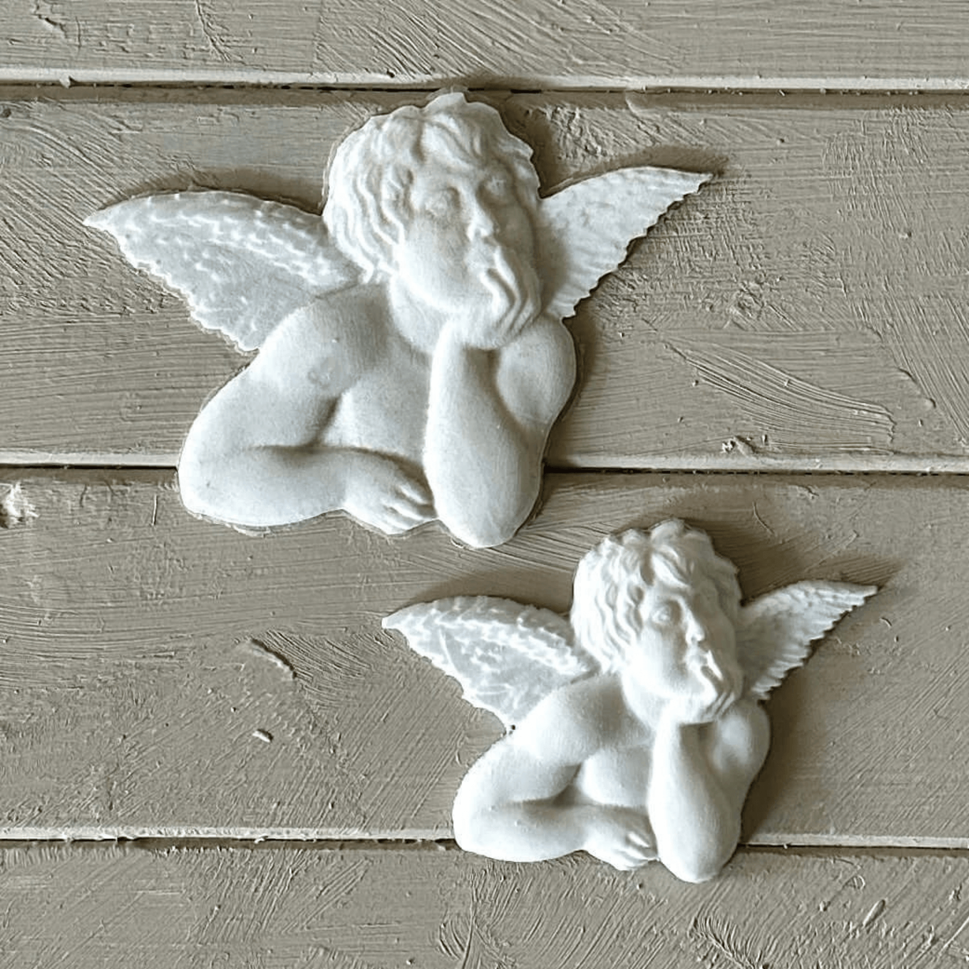 Angel 001 - Cherub Applique for Furniture & Craft Projects featuring two cherub designs in white resin.