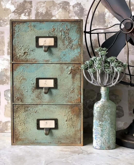 Rust & Aged Techniques Workshop - decorative storage drawers with vintage patina and numbered labels.