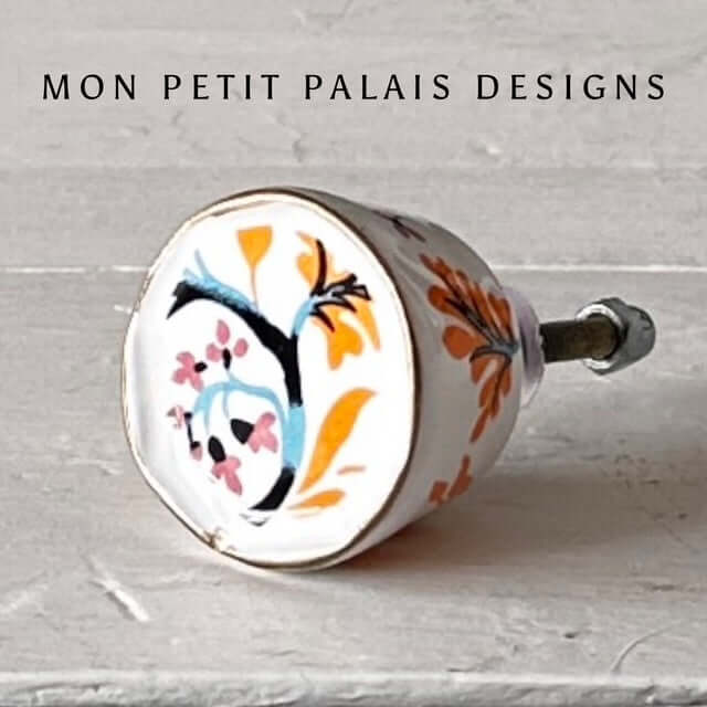 Orange & Blue Floral Hand-Painted Ceramic Knob showcasing vibrant floral design and unique artisan craftsmanship.
