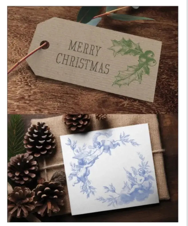Iron Orchid Design Classical Christmas Decor Stamp project of Merry Christmas tag with holly design and a card with floral wreath on a wooden surface with pinecones.