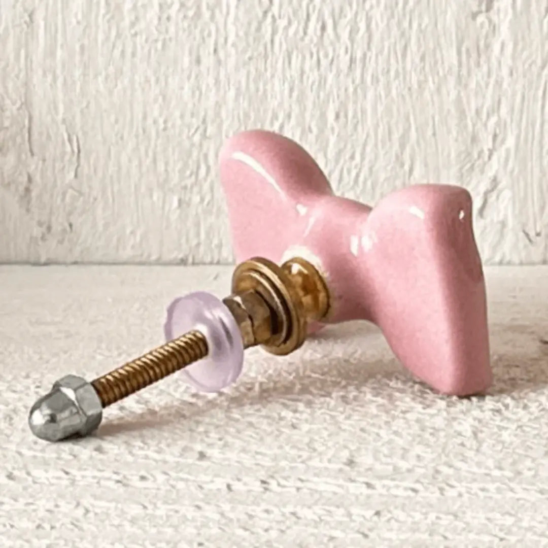 Pink Cute Ceramic Bow Cabinet Knob with glossy finish and hardware for furniture decor.