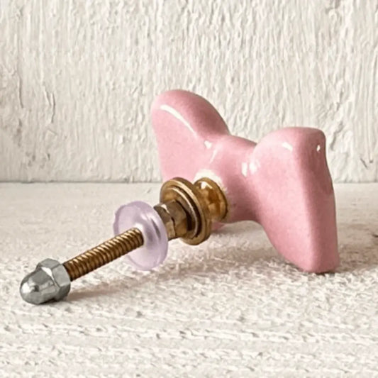 Pink Cute Ceramic Bow Cabinet Knob with glossy finish and hardware for furniture decor.