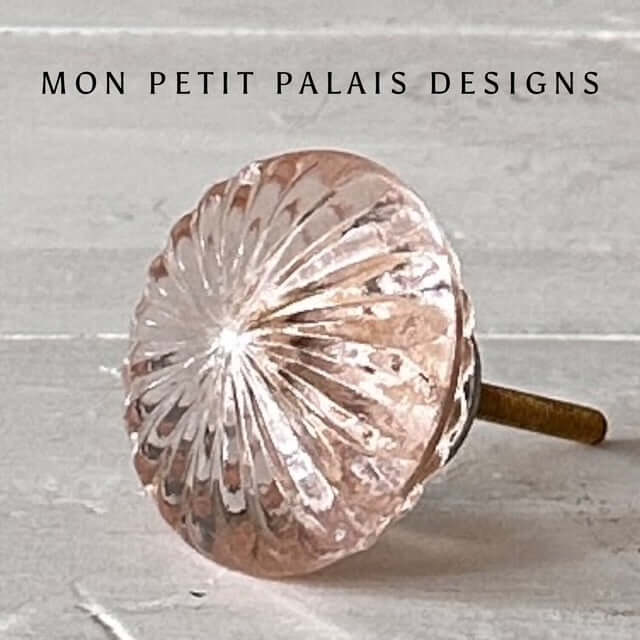 Rose Quartz Pink Glass Knob Vintage-style faceted glass knob with soft pink tint and brass fitting, perfect for furniture and cabinetry.