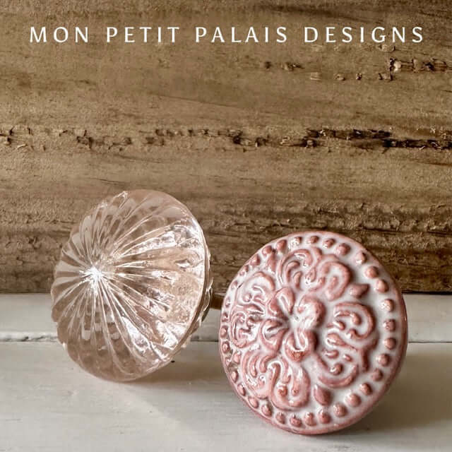 Rose Quartz Pink Glass Knob and Henrietta Rose Ceramic Knob displayed side by side. A vintage-inspired pink ceramic knob with an embossed floral design next to a faceted glass knob with a soft rose tint, perfect for upcycled furniture and cabinetry.