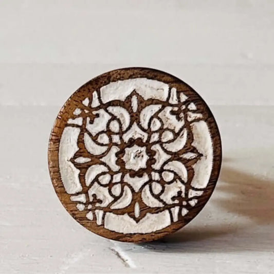 Front view of Zoe carved wood knob featuring etched floral pattern on white background   