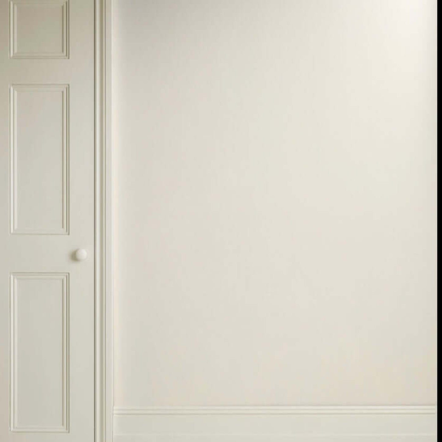 Old White - Annie Sloan Satin Paint used on a wall and door, showcasing a soft and versatile white shade.