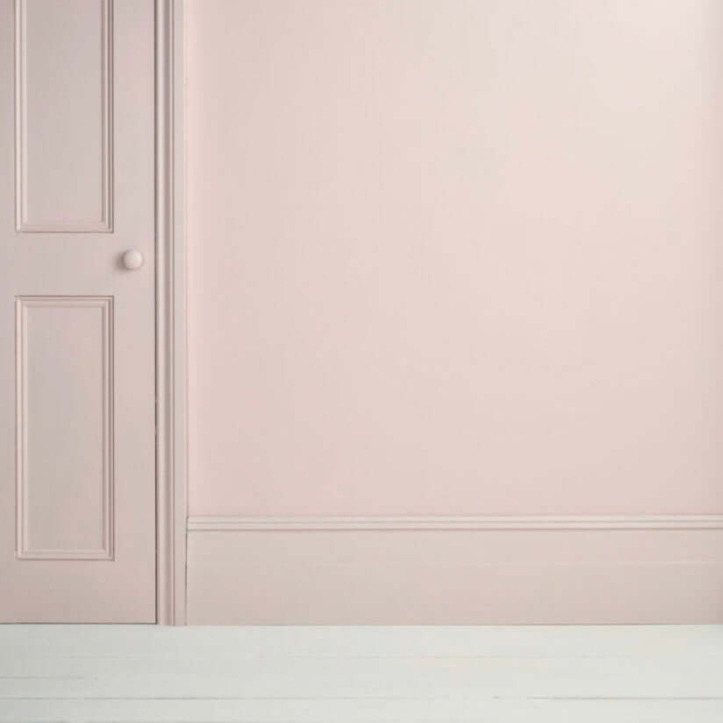 Pointe Silk - Annie Sloan Satin Paint applied on a wall and door, showcasing a soft, cool-toned pink finish.