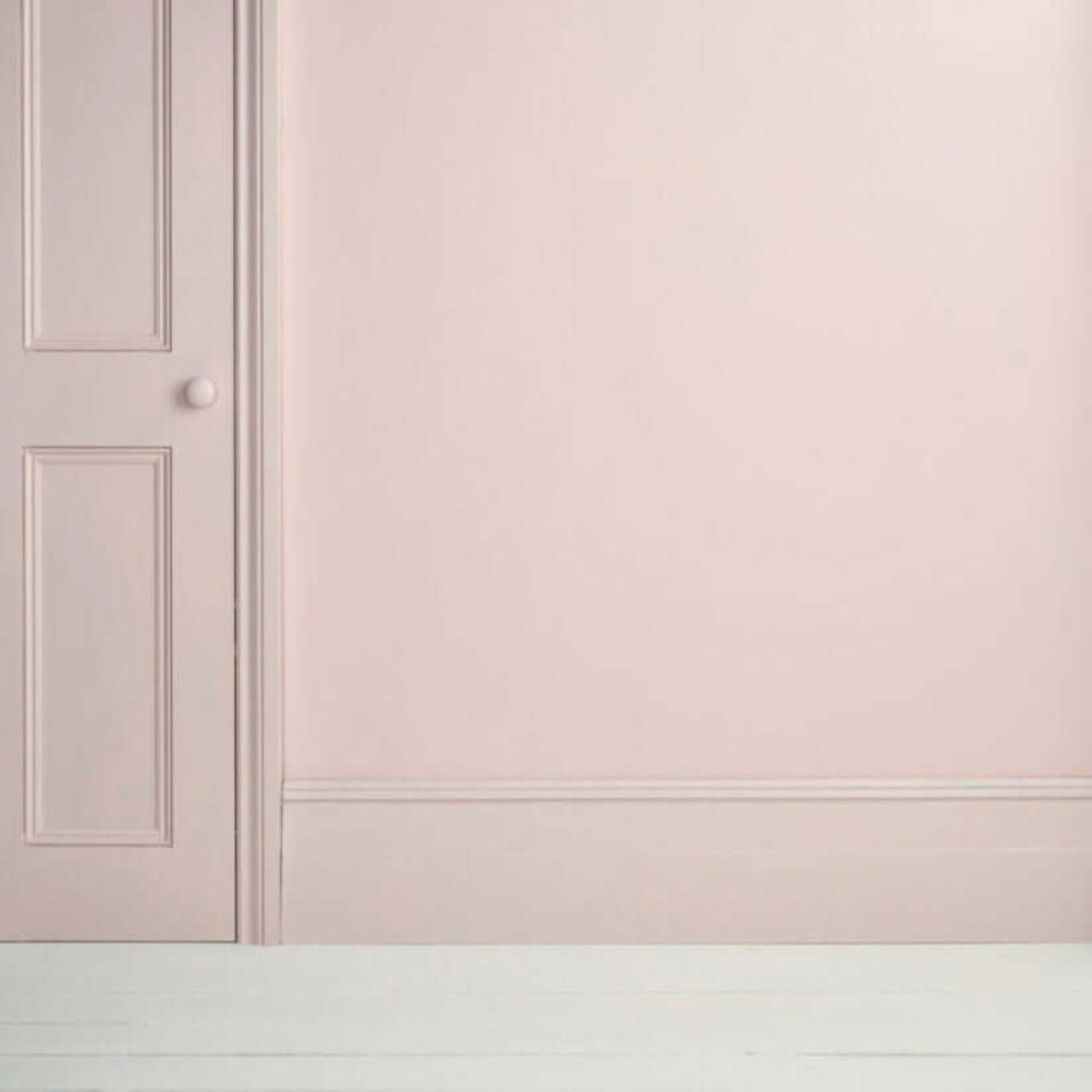 Pointe Silk - Annie Sloan Satin Paint applied on a wall and door, showcasing a soft, cool-toned pink finish.