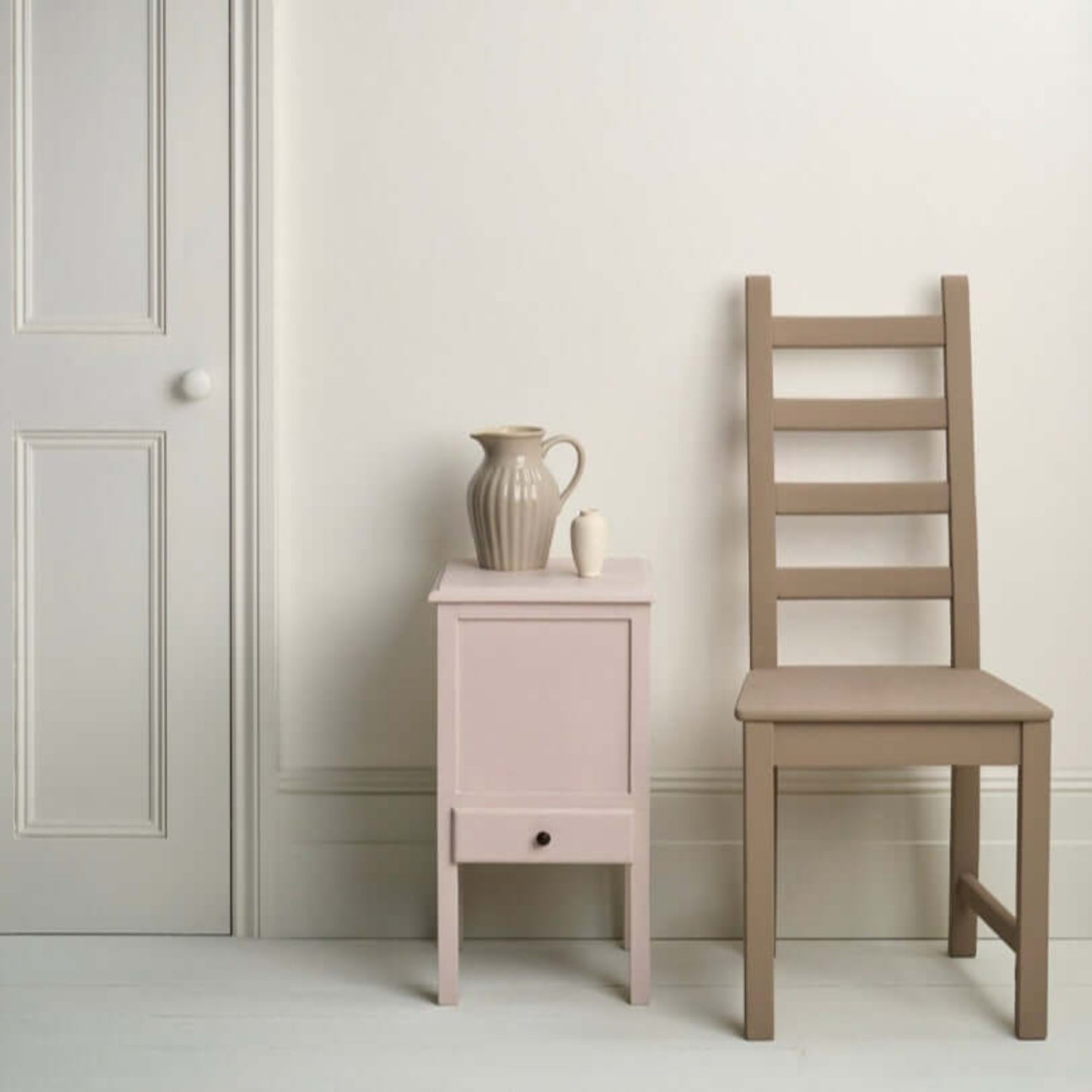 Pure - Annie Sloan Satin Paint used on a bedside table and chair in a minimalist interior setting.