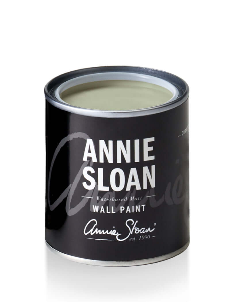 Terre Verte wall paint by Annie Sloan in a black can, featuring a sleek design and a light grey-green color.