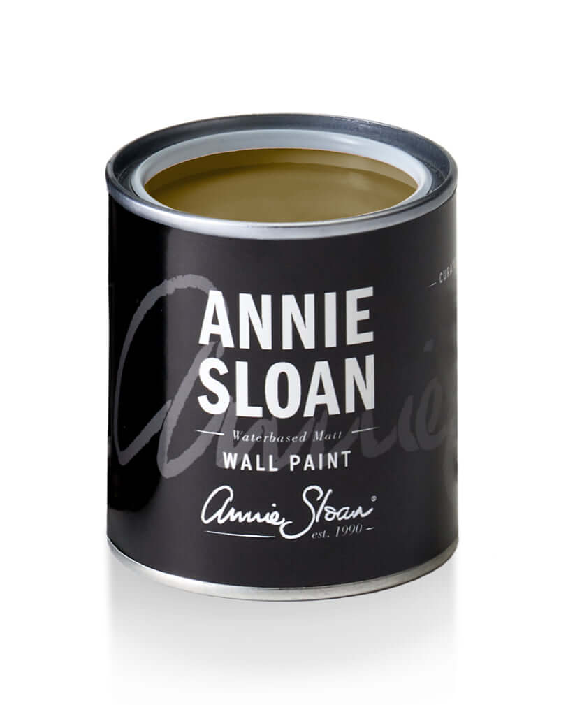 Annie Sloan Olive wall paint can showcasing a dark khaki green color for serene home decor.