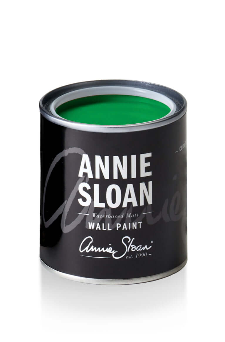 Can of Schinkel Green Annie Sloan Wall Paint® with vibrant green paint inside.