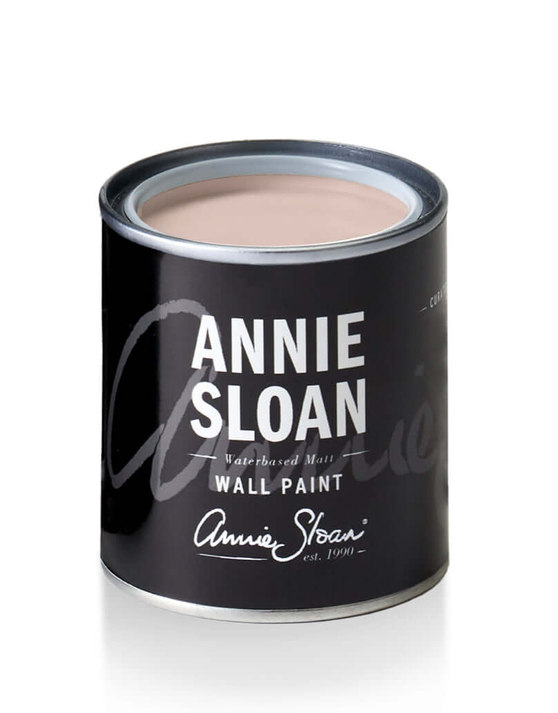 Annie Sloan Pointe Silk wall paint can with a soft pink color, showcasing the product branding and design.