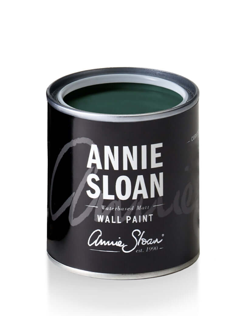 Knightsbridge Green - Annie Sloan Wall Paint can with lid off showing dark green color.